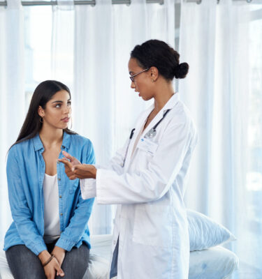 Shot of a young woman having a consultation with her doctor